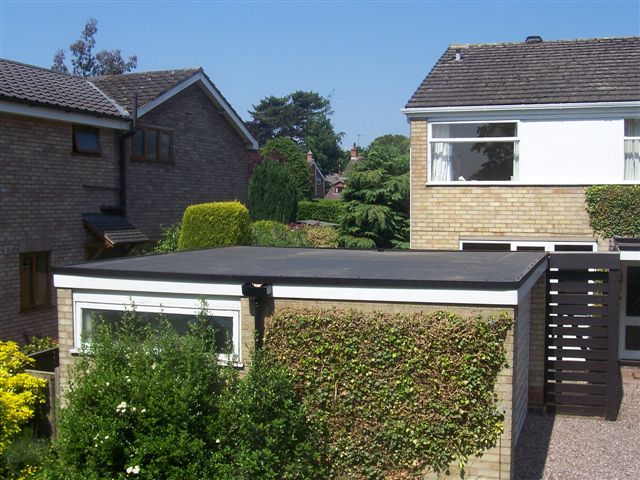 Home in Sandbach with firestone rubbercover roofing on a garage.